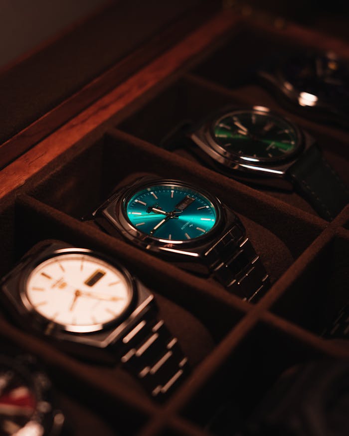 Showcase of elegant luxury watches in a display case with warm lighting.